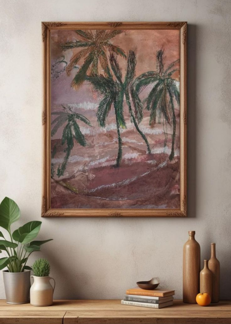 Tropical-themed wall art with palm tree motifs in earthy blush and green tones, framed above a wooden console with ceramic vases, books, and indoor plants.